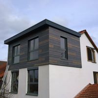 haus bau ausbau erweiterung holz fassade erker